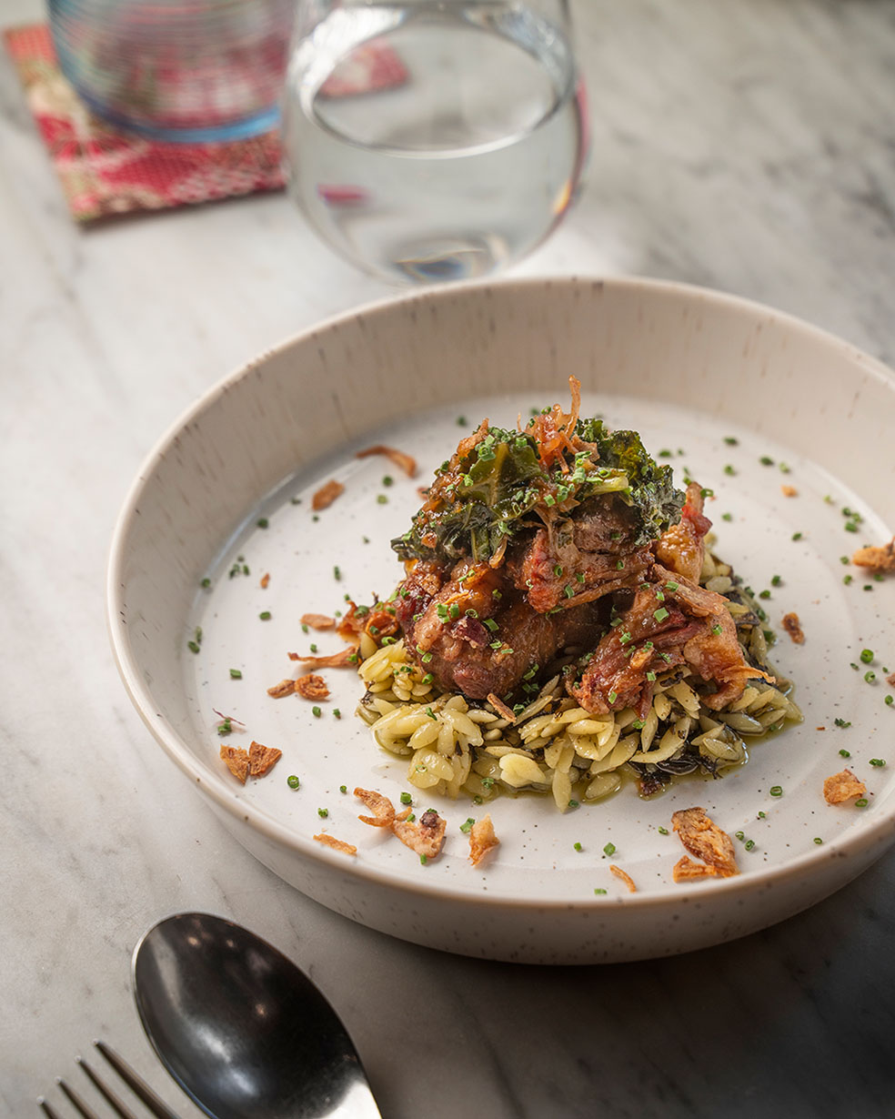 Grain-Fed Oxtail with orzo "fried rice", kale pickle and shallot oil